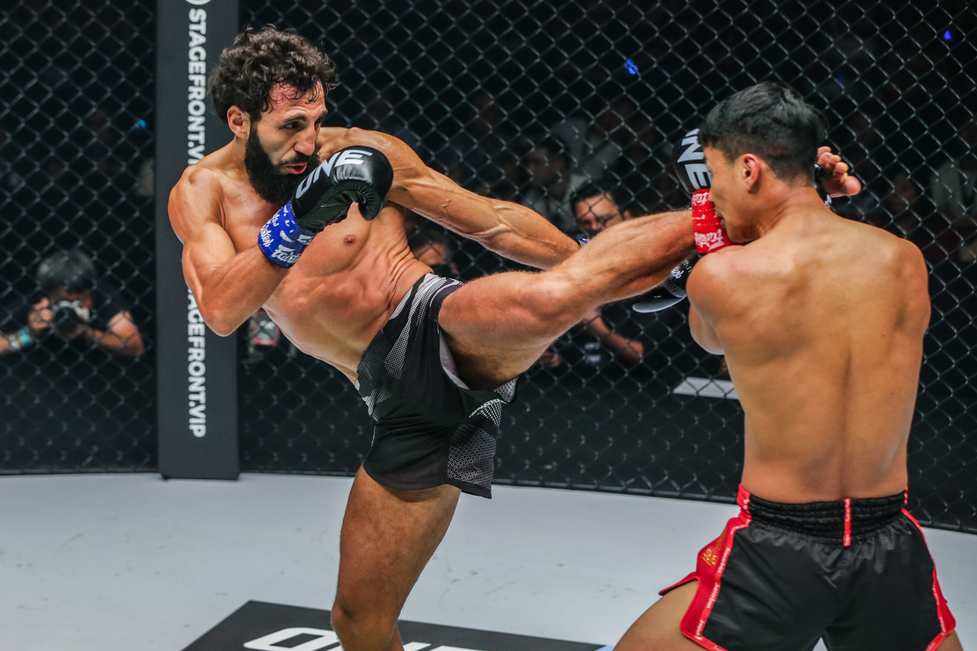 Chingiz Allazov throws a kick on Superbon Singha Mawynn at ONE Fight Night 6